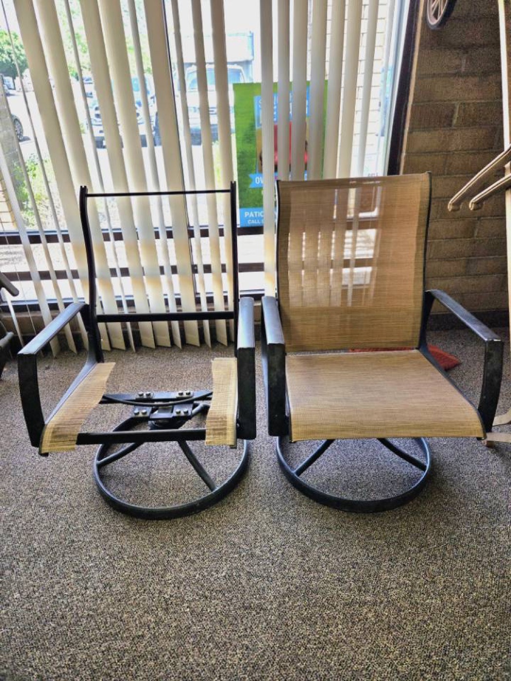 Patio chairs in shop with one missing sling and one restored sling